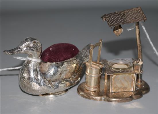 An Edwardian novelty silver duck pin cushion by Crisford & Norris, Birmingham 1906, well 3.25in.